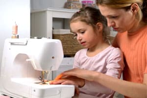 child at a sewing machine
